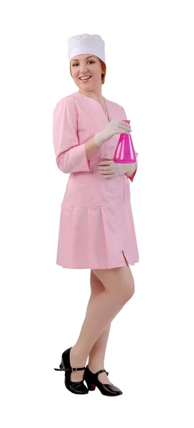 Laboratory assistant with pink flask in hand — Stock Photo, Image