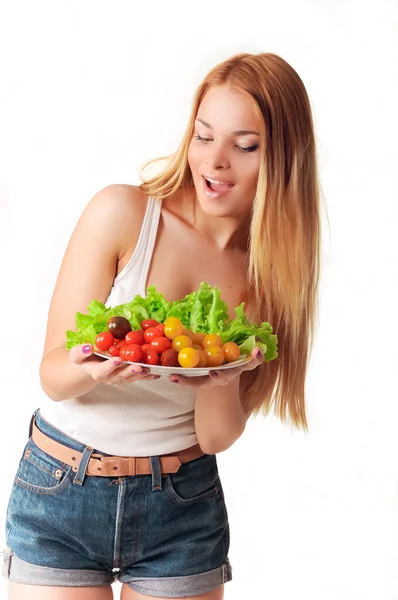 Girl with a plate of tomato — Stock Photo, Image