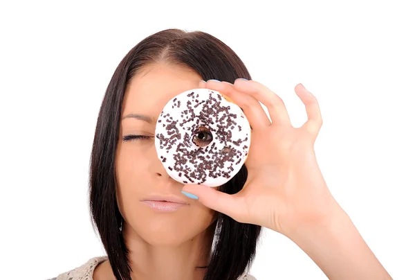 Chica mirando a través de un agujero en un donut — Foto de Stock