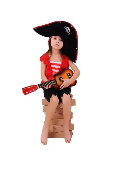 Small pirate sitting on a stack of paper — Stock Photo, Image