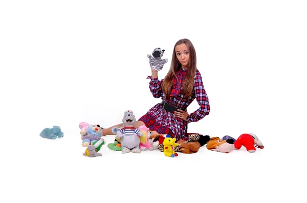 Girl playing with soft toys — 图库照片