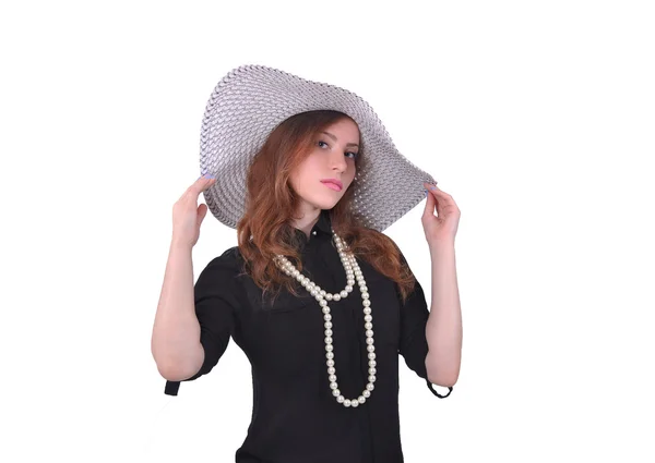 Girl in a black dress and a white hat — Stock Photo, Image