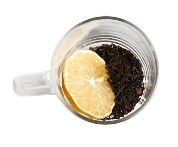 Tealeaves in tazza con limone — Foto Stock