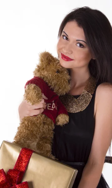Lovely woman in black dress with teddy bear Stock Photo
