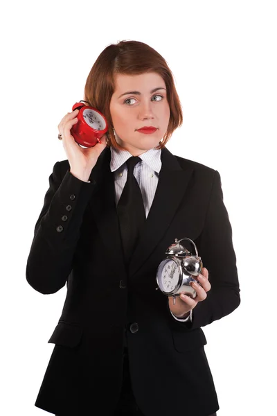 Mädchen hört auf die tickende Uhr — Stockfoto