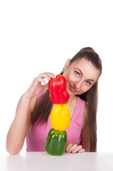 Girl holds three pepper — Stock Photo, Image