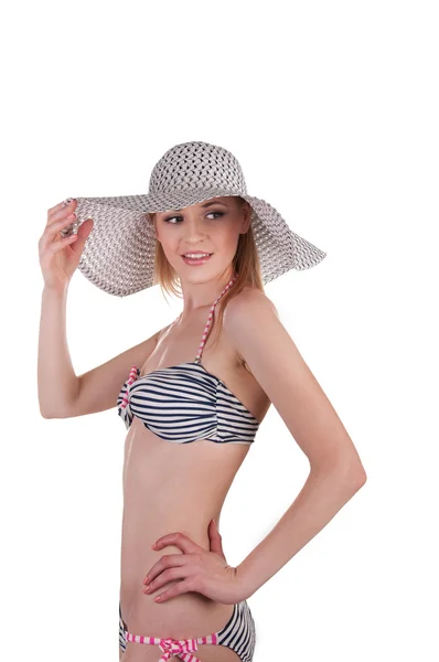 Beautiful girl in a bathing suit and hat — Stock Photo, Image