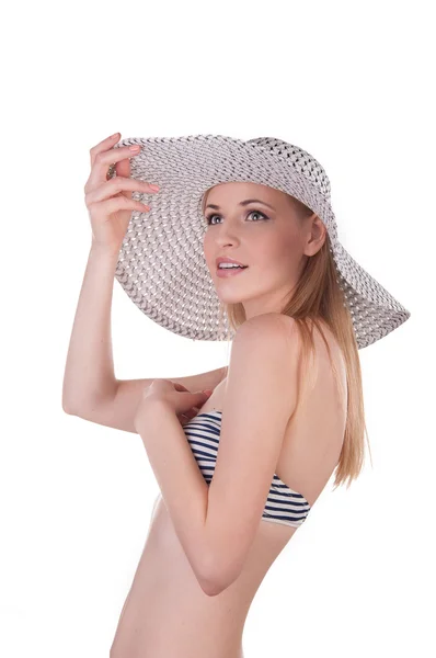 Beautiful girl in a bathing suit and hat — Stock Photo, Image