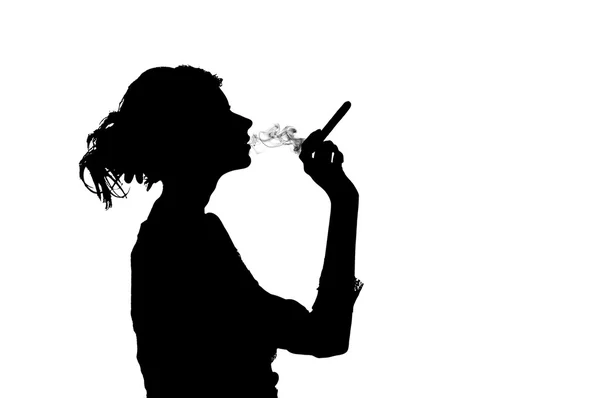 Silhouette of smoking woman Stock Photo