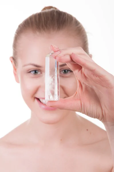 Beautiful girl holding hands mineral — Stock Photo, Image