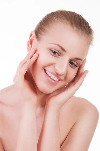 Beautiful young woman touching her face — Stock Photo, Image