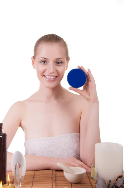 Beautiful girl holding a cream — Stock Photo, Image