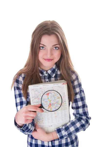 Schoolmeisje holding een vergrootglas en kaart — Stockfoto