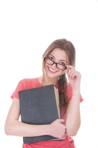 Hermosa colegiala sosteniendo un libro en sus manos —  Fotos de Stock