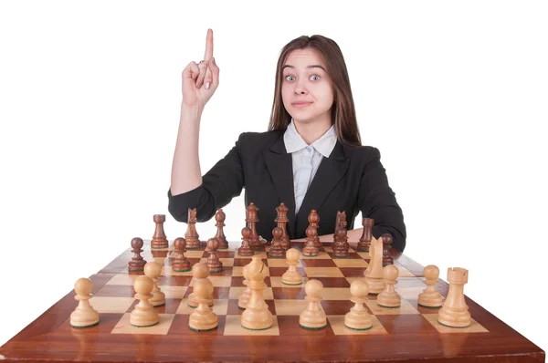 Девушка играет в шахматы Лицензионные Стоковые Изображения