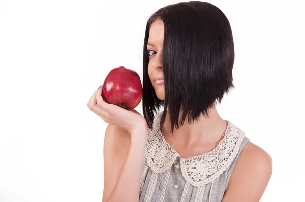 Girl holding an apple — Stock Photo, Image