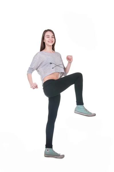 Niedliches Mädchen macht Übungen auf weißem Hintergrund — Stockfoto