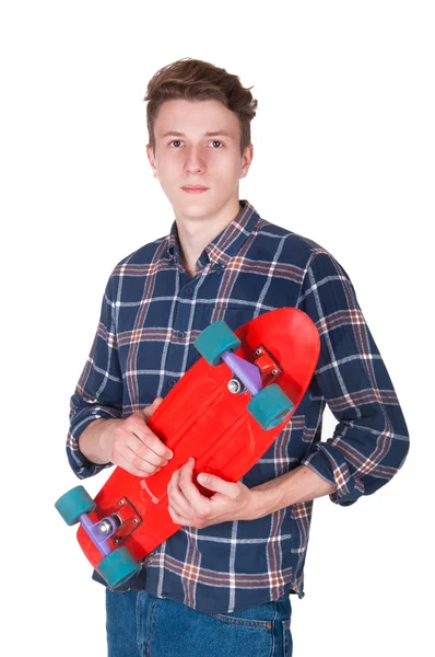 年轻男子手持一个滑板 — 图库照片
