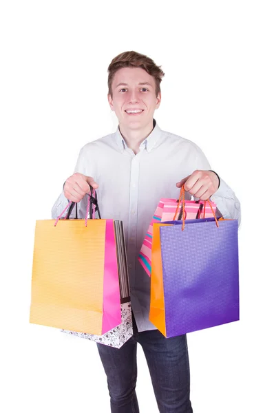 Young man with full of bags — Stock Photo, Image