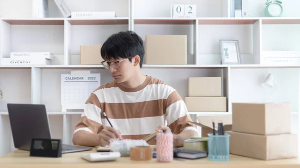 Young Man Uses Laptop Chat Customers Who Come Order Product — Stock Photo, Image