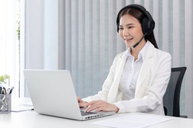 Operator agent with headsets working in a call center, Employee is chatting or giving advice and basic information to customers who need services, Customer care, Provide information, Call center.