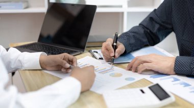 Brainstorm team, Marketers and financial accountants are discussing and analyzing charts to plan a company's growth and development strategy, Team meetings or business consulting, Business profit.