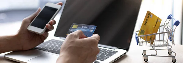 Businessman use mobile phones to register for security Online with a credit card to buy products online through application,Online shopping or Internet technology concept.