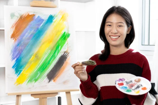 Female artist painting on canvas, Artist studio interior, Draw with watercolor, Drawing supplies , Painting and creativity, Use a brush to draw a pattern by stripes, Artwork, Using Paint Brush.