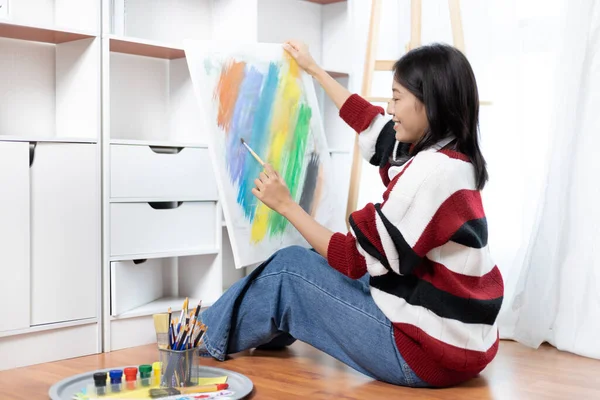 Female artist painting on canvas, Artist studio interior, Draw with watercolor, Drawing supplies , Painting and creativity, Use a brush to draw a pattern by stripes, Artwork, Using Paint Brush.