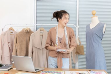 Professional female designers are sketching outfits to suit the needs of their customers, Fashion designer, Creativity and ideas, Mannequin, Shirt sketch, Color scheme, Garment accessories.