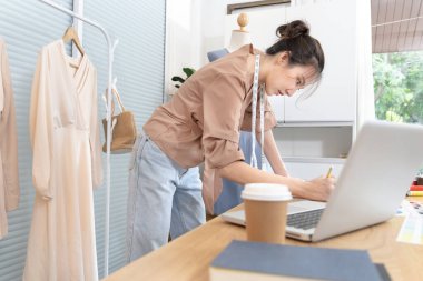 Professional female designers are sketching outfits to suit the needs of their customers, Fashion designer, Creativity and ideas, Mannequin, Shirt sketch, Color scheme, Garment accessories.