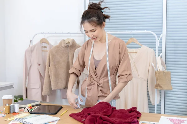 Professional designers are cutting fashionable clothes in the design studio, Fashion designer, Creativity and ideas, Mannequin, Shirt sketch, Color scheme, Garment accessories ,work independently.