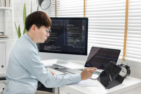 Professional development programmers are using tablet to test the functionality of their applications after programming, Write data or code for websites and applications,  HTML, javascript, Software.