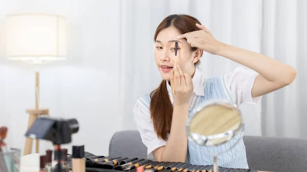 Beautiful women with social media influences are teaching makeup and use cosmetics, In front of the camera to recording vlog video live streaming, Online business on concept of beauty bloggers.