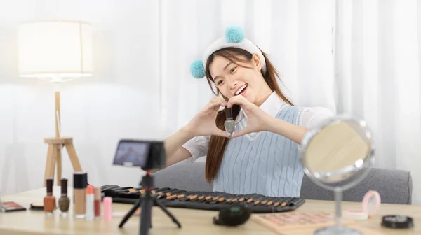 Beautiful women with social media influences recommend products and make-up accessories to be more beautiful, Recording vlog video live streaming, Online business of beauty bloggers.