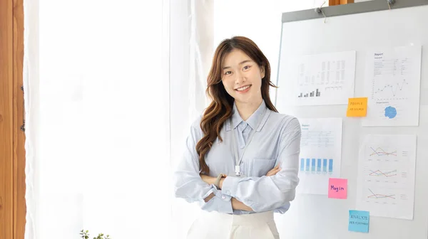 Office worker with a beautiful Asian woman in a private office, Daily routine of office workers, Welcome to work in the morning with a bright smile, Businesswoman in office concept.