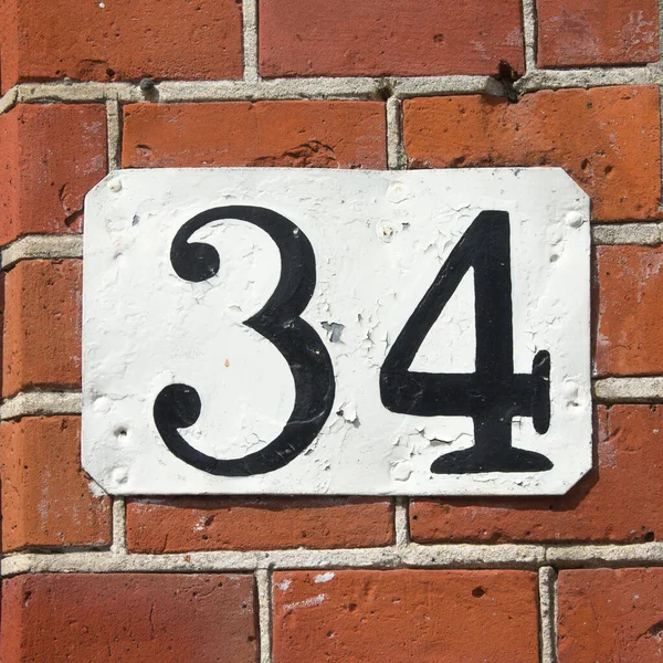 House Number Thirty Four Painted Plate — Stock Photo, Image