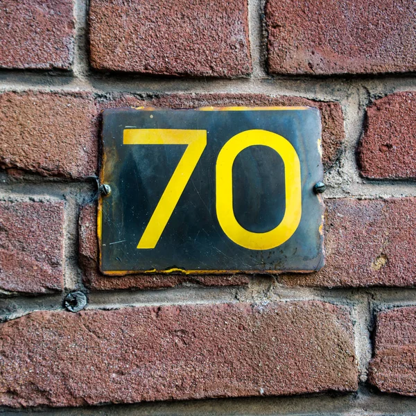 Enameled House Number Seventy Brick Wall — Stock Photo, Image