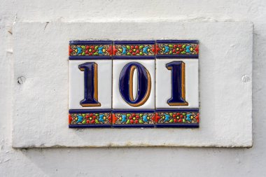 ceramic house number one hundred and one (101) on three sepearate tiles. clipart