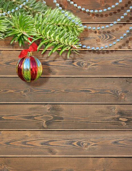 ahşap arka plan üzerinde Noel oyuncaklar