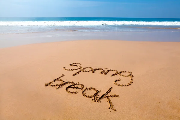 Весняна перерва написана в піску тропічний пляж Стокове Фото
