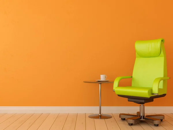 Silla verde contra pared naranja — Foto de Stock