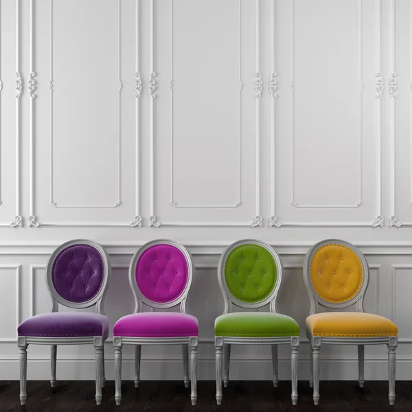 Fancy colorful chairs against a white wall — Stock Photo, Image