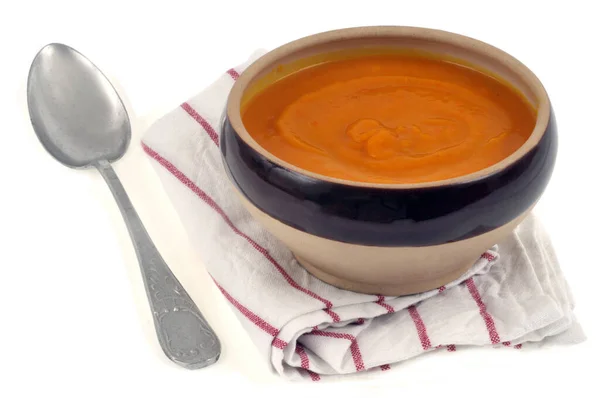Bowl Pumpkin Soup Placed Tea Towel Next Spoon White Background — Stock Photo, Image