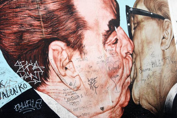 Berlin, Germany, March 25, 2013: The kiss of Brezhnev and Honecker painted on the East Side Gallery