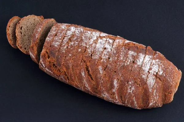 Sliced Rye Bread Black Background — стоковое фото