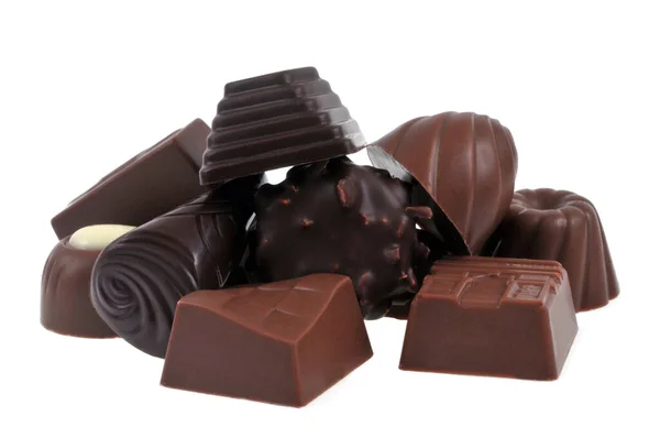Sortiment Choklad Staplade Närbild Vit Bakgrund — Stockfoto