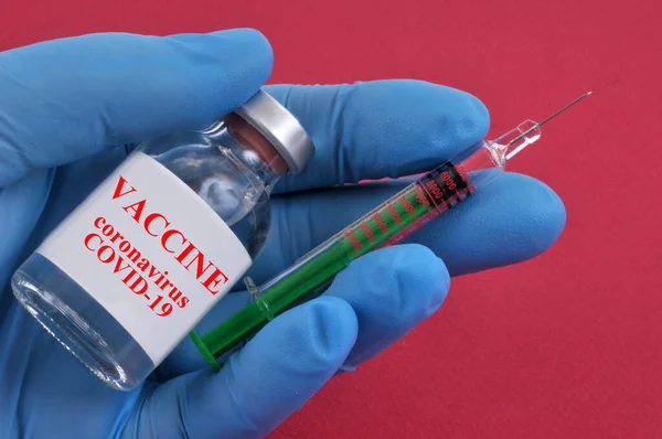 Coronavirus Vaccine Concept Vial Latex Gloved Syringe Red Background — Stockfoto