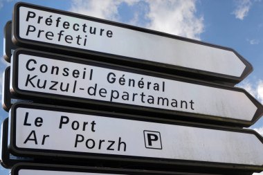 Road signs in French and Breton in Vannes in Brittany clipart