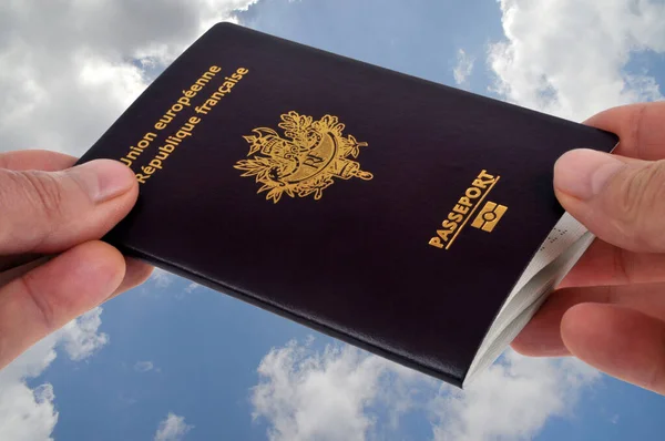 Passport Exchange Hand Hand Close Cloudy Sky Background — стокове фото